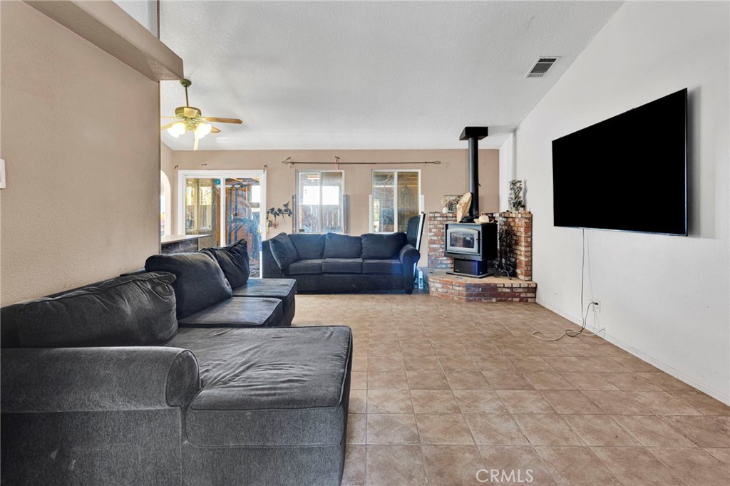 6414 Nielson Road Phelan, CA 92371 - Photo 6 of 74 a living room with furniture and a flat screen tv