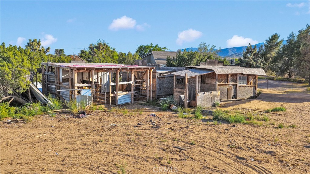 6414 Nielson Road Phelan, CA 92371 - Photo 64 of 74 a view of a house with a yard and sitting area