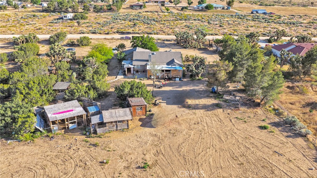 6414 Nielson Road Phelan, CA 92371 - Photo 66 of 74 an aerial view of a house with a yard and seating space
