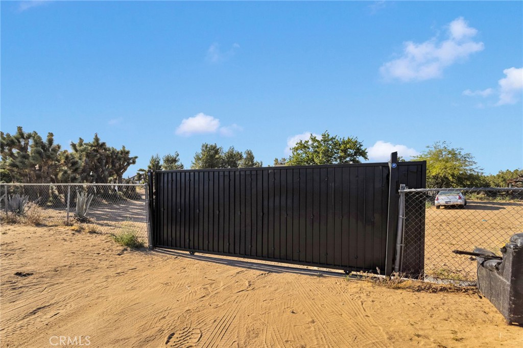 6414 Nielson Road Phelan, CA 92371 - Photo 67 of 74 a wooden fence with a view of small space