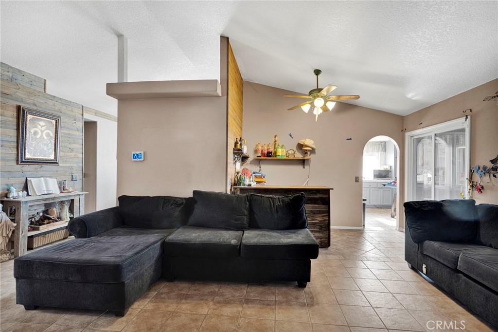 6414 Nielson Road Phelan, CA 92371 - Photo 8 of 74 a living room with furniture and a large mirror