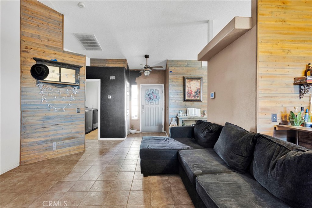6414 Nielson Road Phelan, CA 92371 - Photo 10 of 74 a living room with furniture and a fireplace