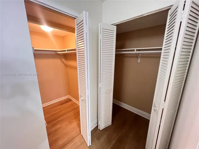 a view of front door with wooden floor