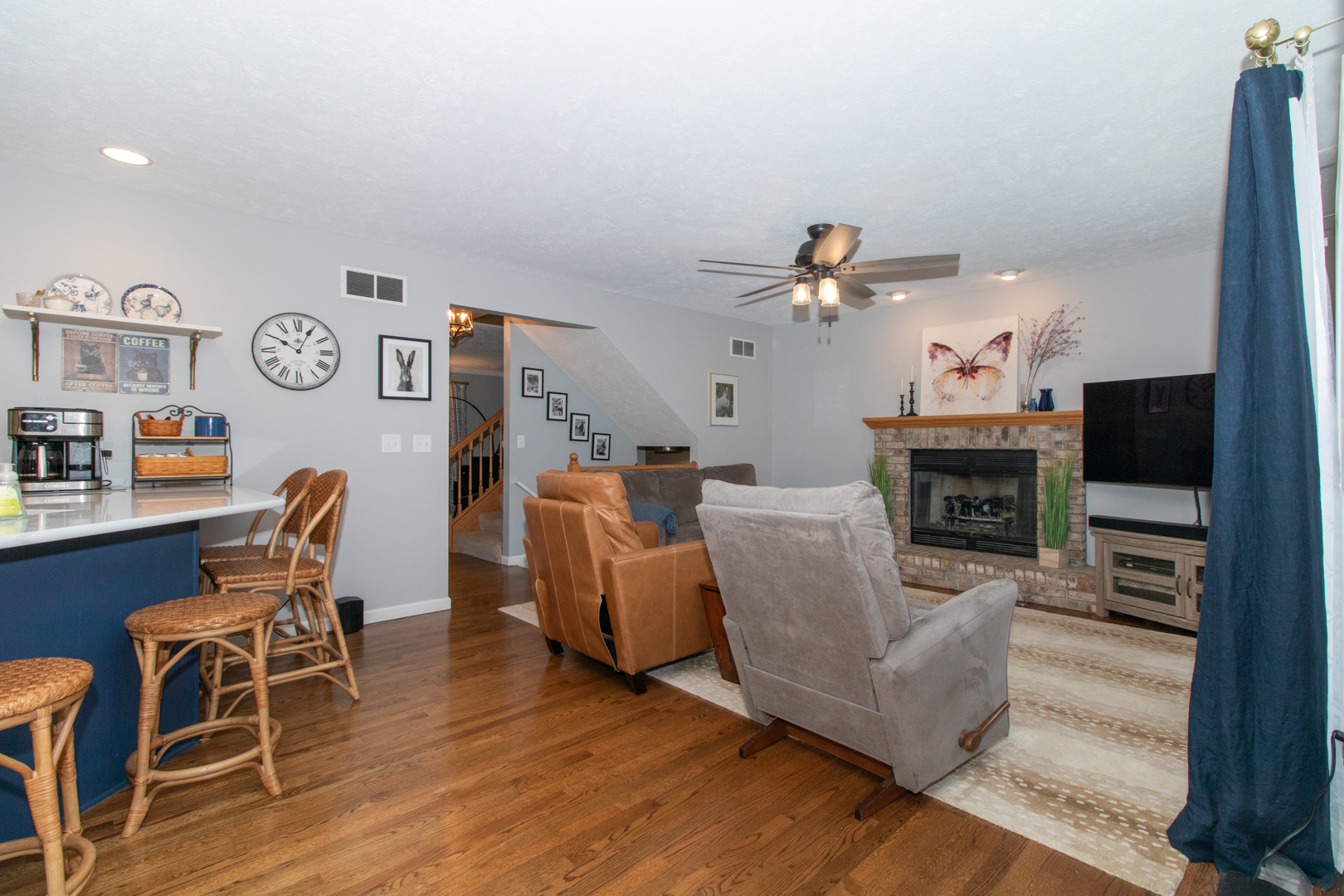 2973 Three Eagles Street Normal, IL 61761 - Photo 11 of 56 a living room with furniture a fireplace and a flat screen tv