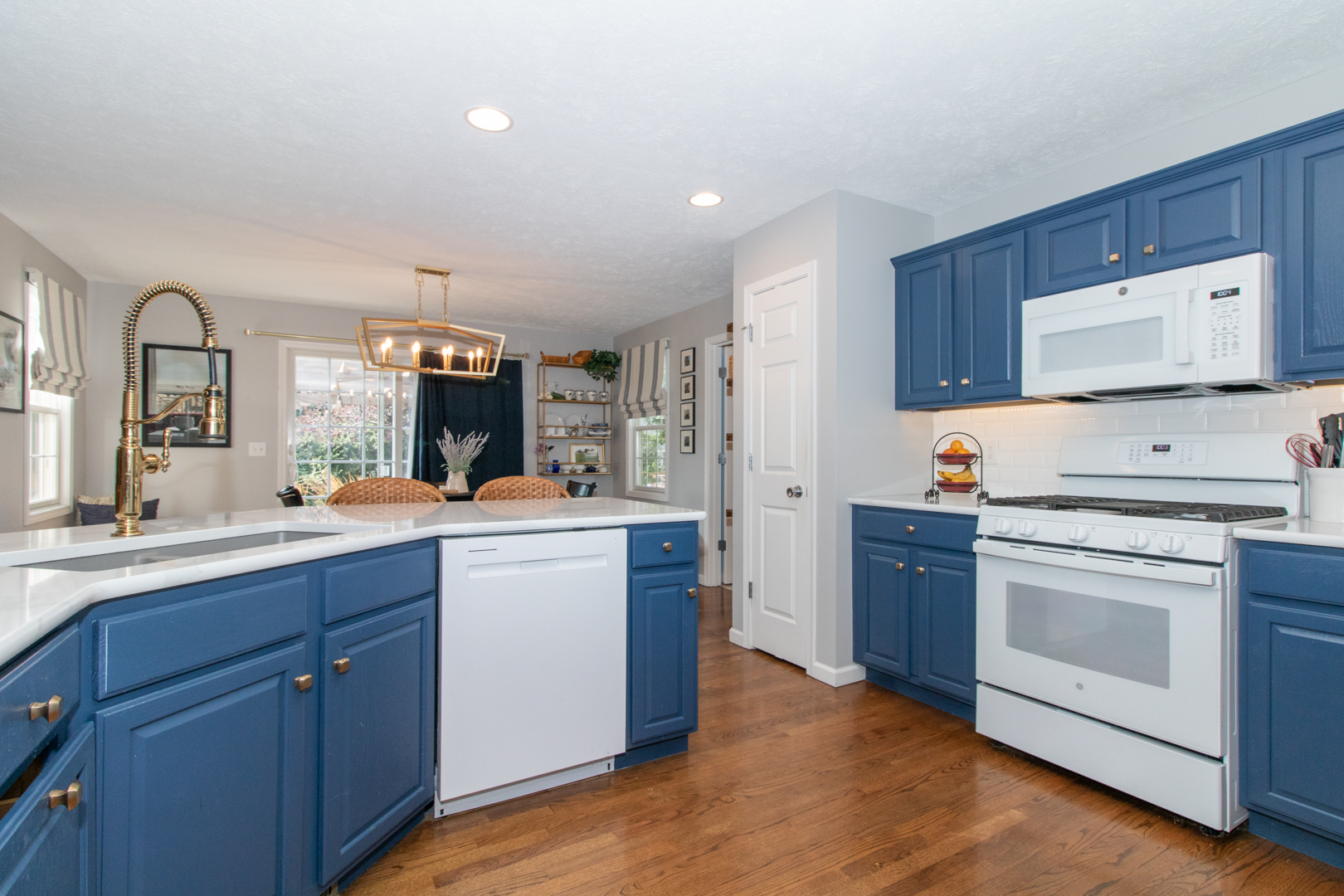 2973 Three Eagles Street Normal, IL 61761 - Photo 16 of 56 a kitchen with white cabinets and white appliances