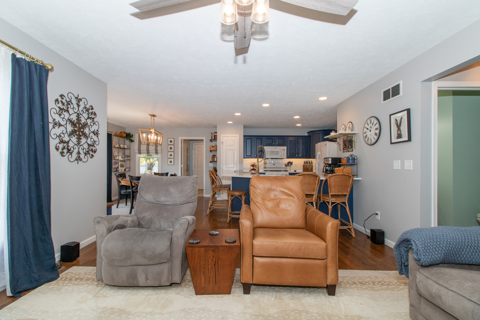 2973 Three Eagles Street Normal, IL 61761 - Photo 24 of 56 a living room with furniture kitchen view and a chandelier