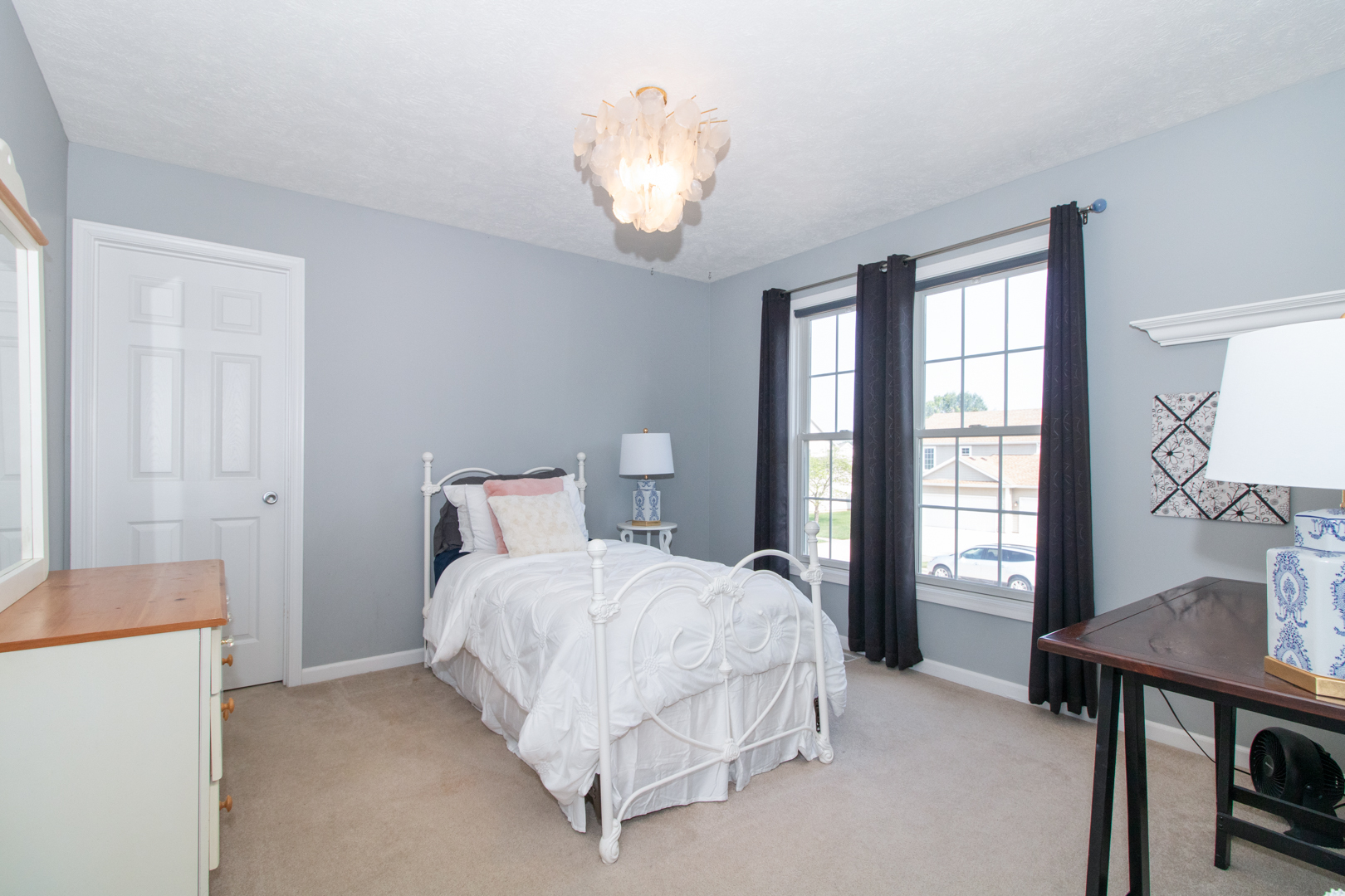 2973 Three Eagles Street Normal, IL 61761 - Photo 27 of 56 a bedroom with a bed and a chandelier