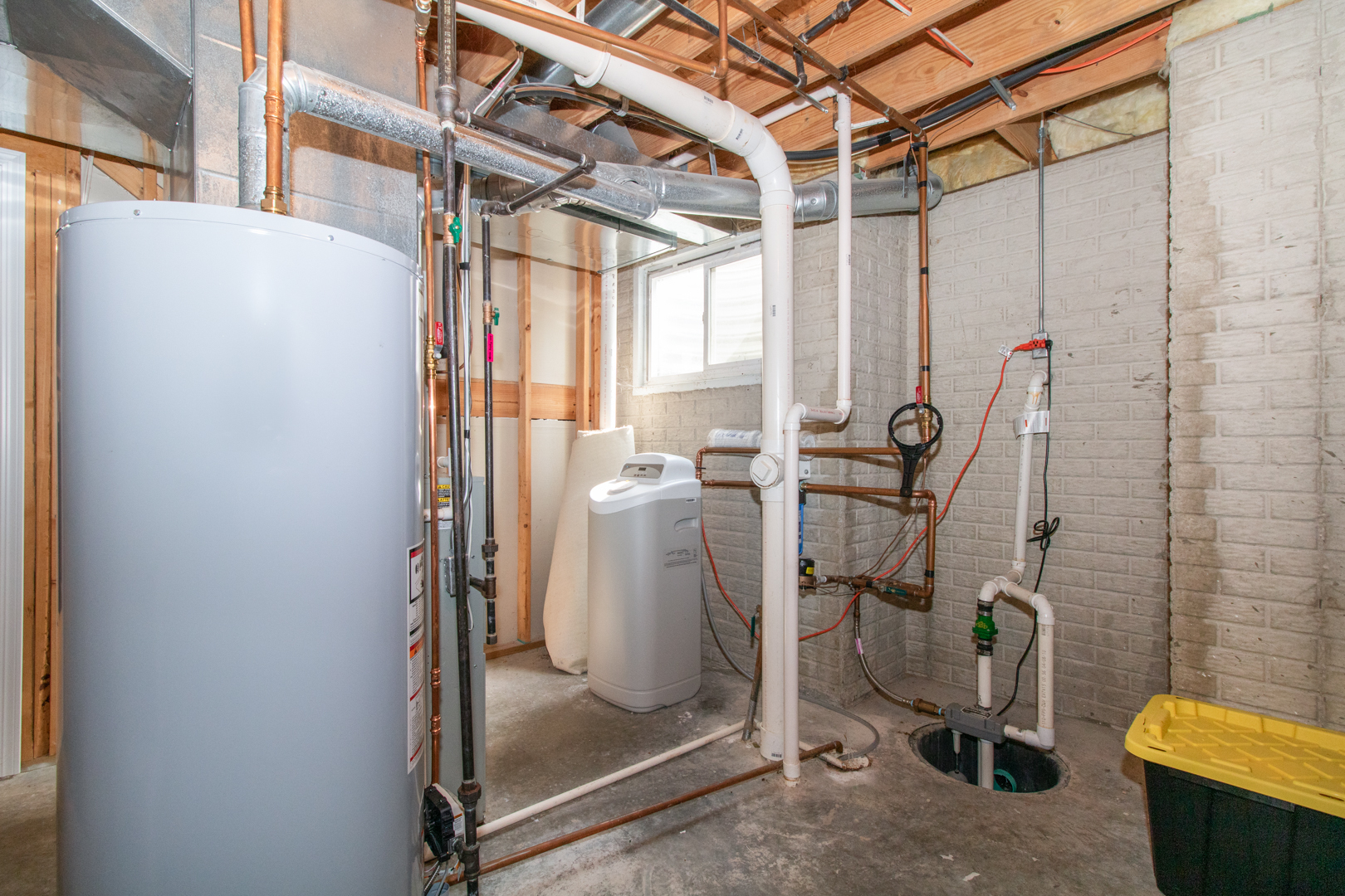 2973 Three Eagles Street Normal, IL 61761 - Photo 45 of 56 a view of a room with water heater and a door