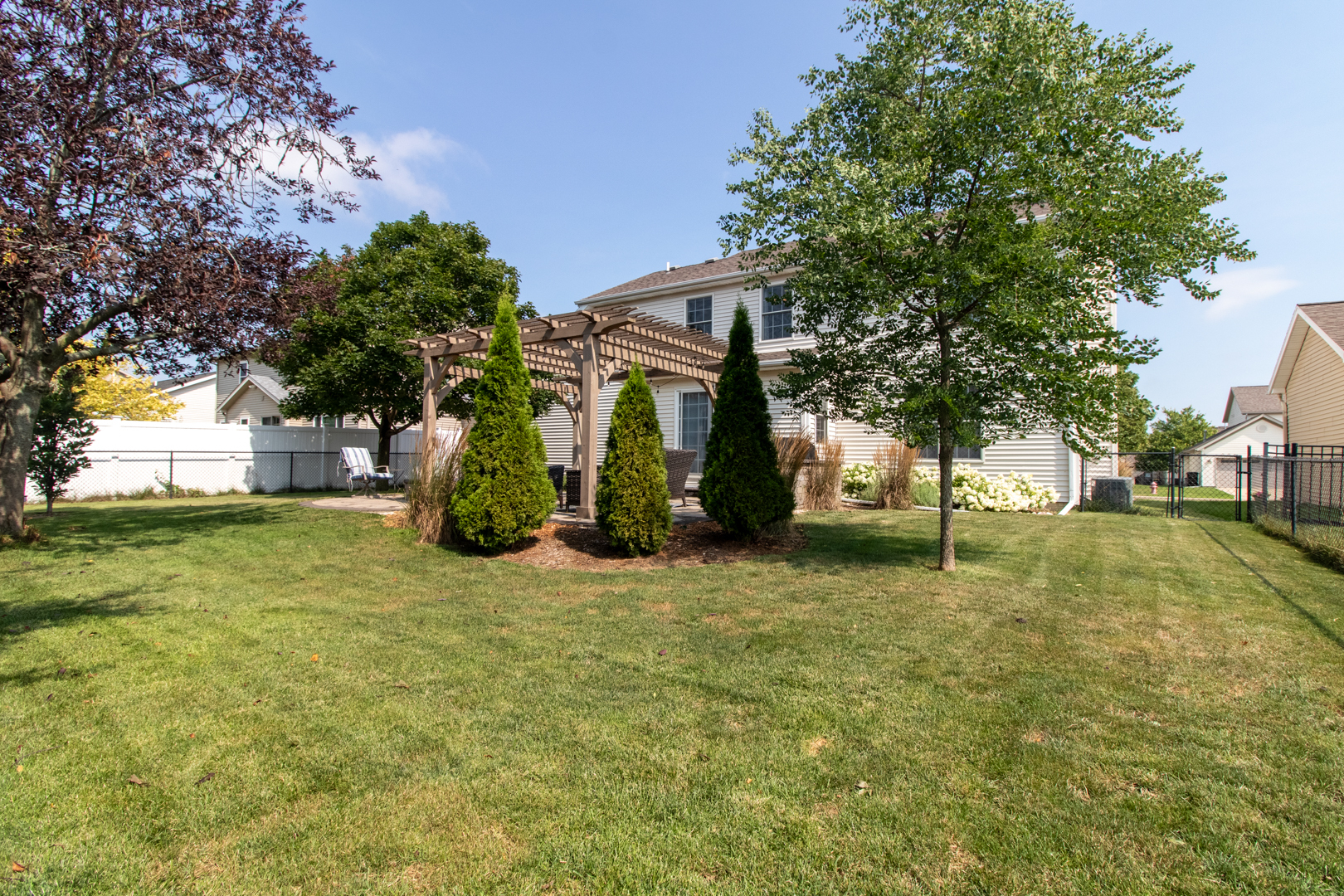 2973 Three Eagles Street Normal, IL 61761 - Photo 54 of 56 a view of a yard with a house and a large tree
