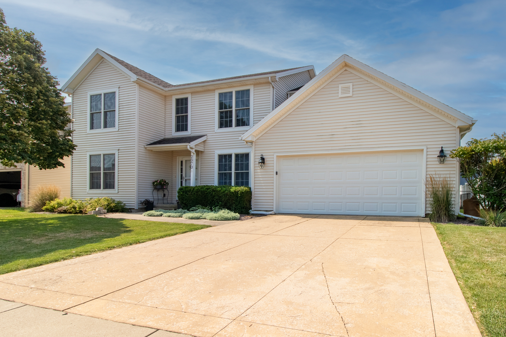 2973 Three Eagles Street Normal, IL 61761 - Photo 56 of 56 a front view of a house with a yard and garage