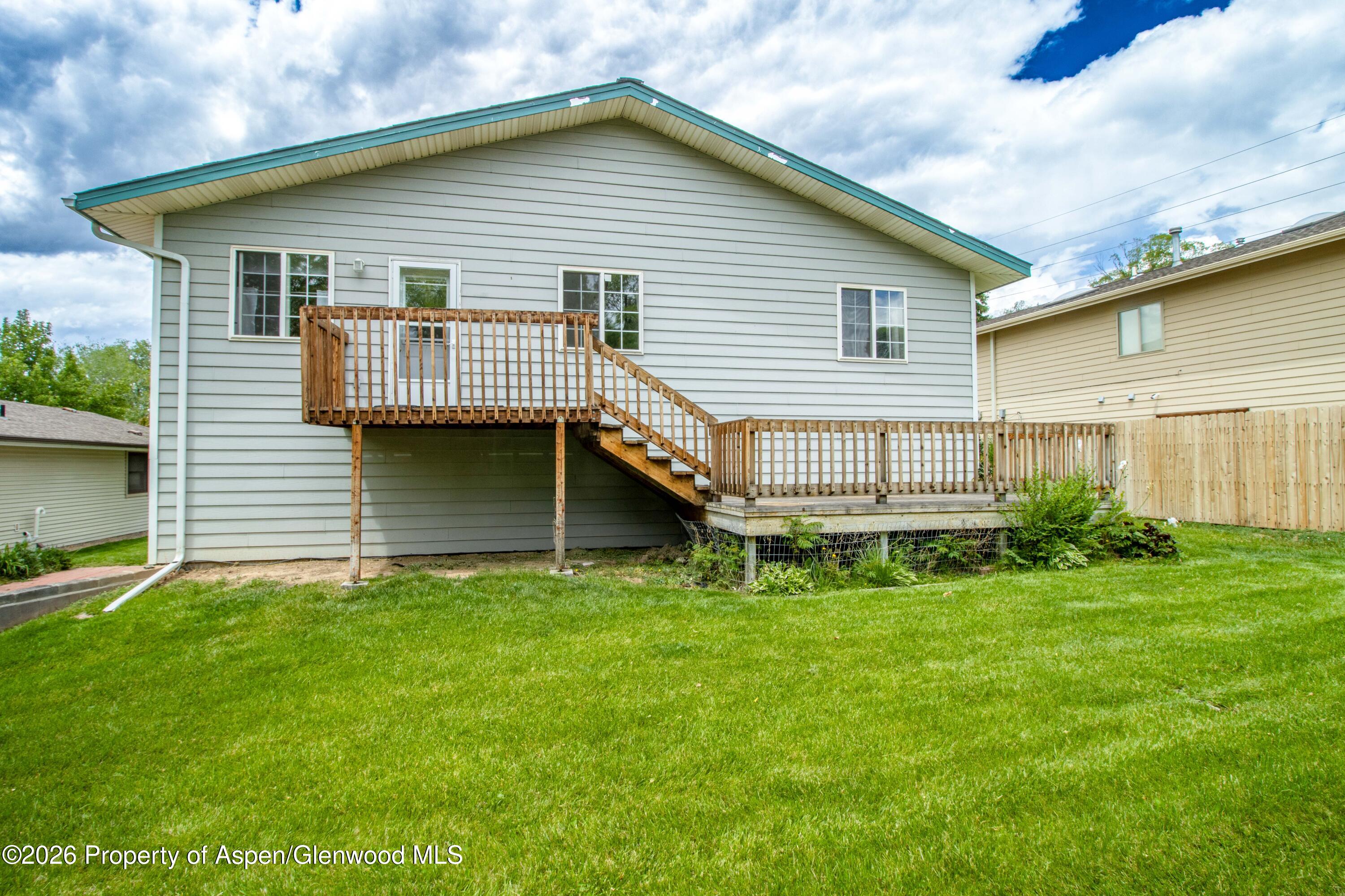 660 Aspen Avenue Rifle, CO 81650 - Photo 16 of 30 a front view of a house with a garden