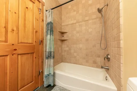 a bathroom with a white bath tub