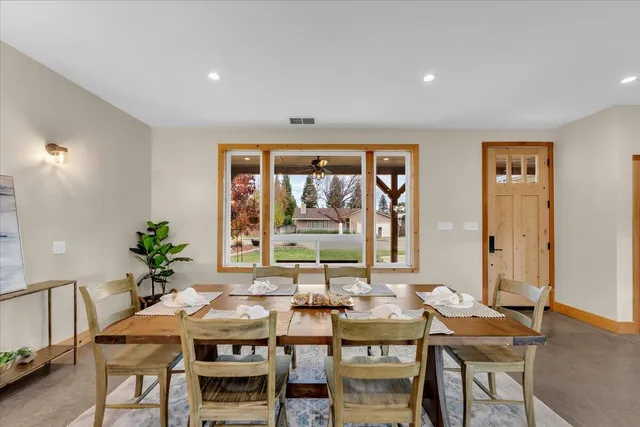 a view of a dining room with furniture window and outside view