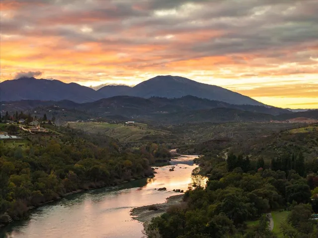 a view of a house with a mountain in the background