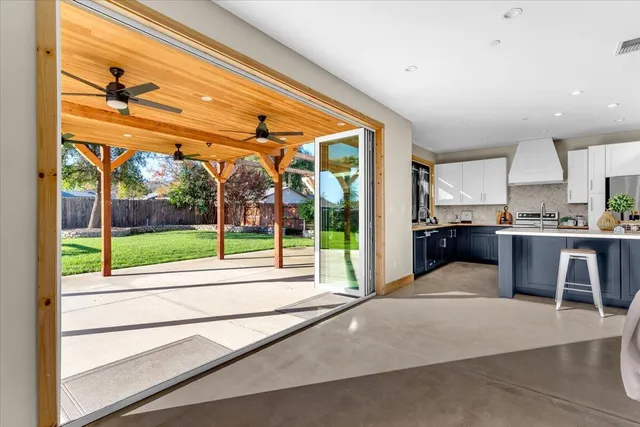 a view of kitchen with furniture and large windows