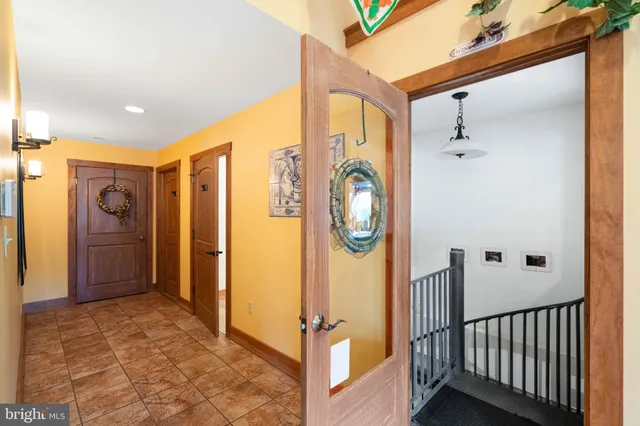 a view of a dining room with furniture and a potted plant