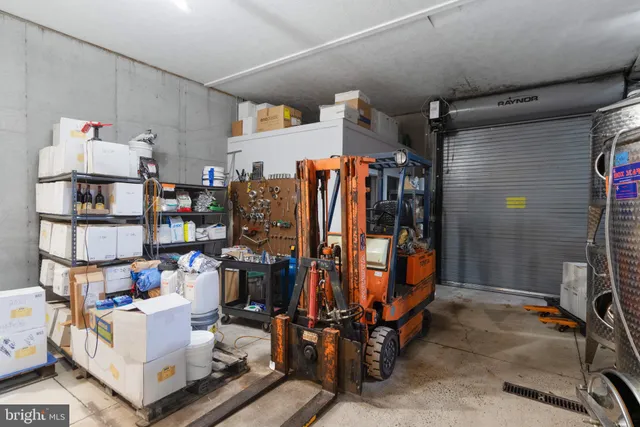 a view of a lake with a floor to ceiling window next to a yard