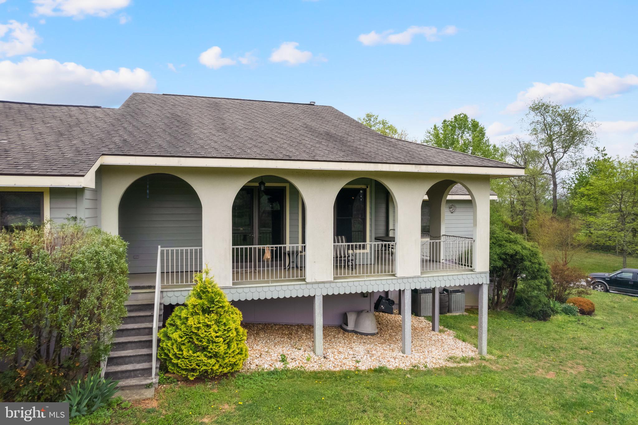 92 School House Road Washington, VA 22747 - Photo 3 of 68 a view of a house with porch and garden
