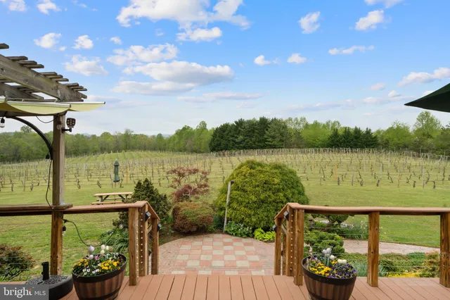a swimming pool with outdoor seating and yard