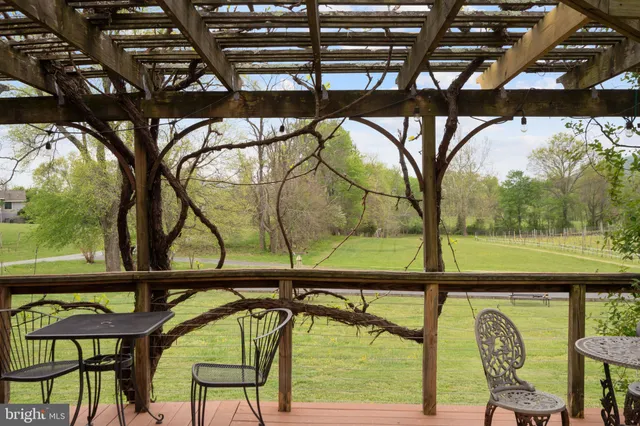 a living room with fireplace furniture and a chandelier