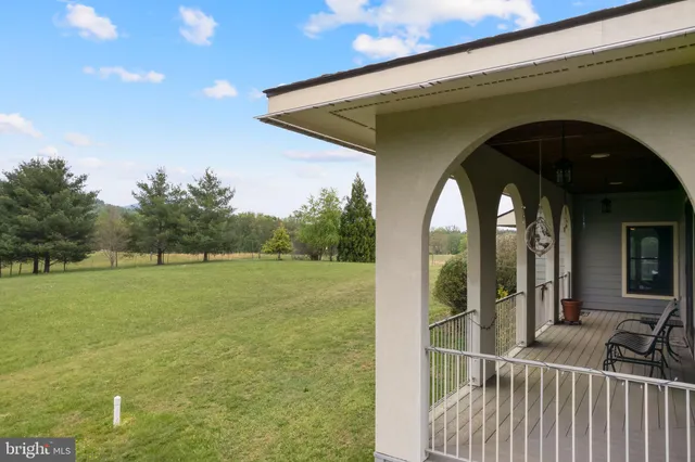 a view of a balcony with furniture