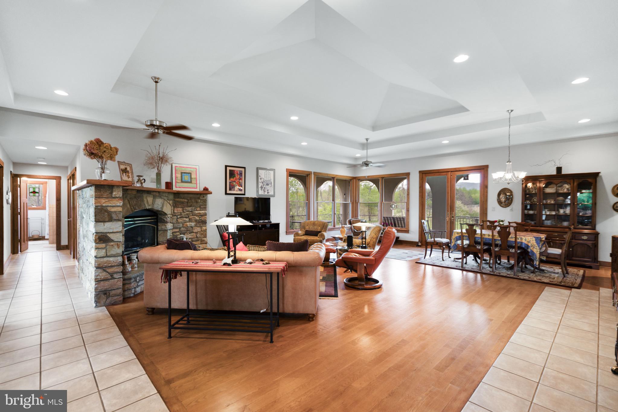 92 School House Road Washington, VA 22747 - Photo 47 of 68 a living room with fireplace furniture and a chandelier