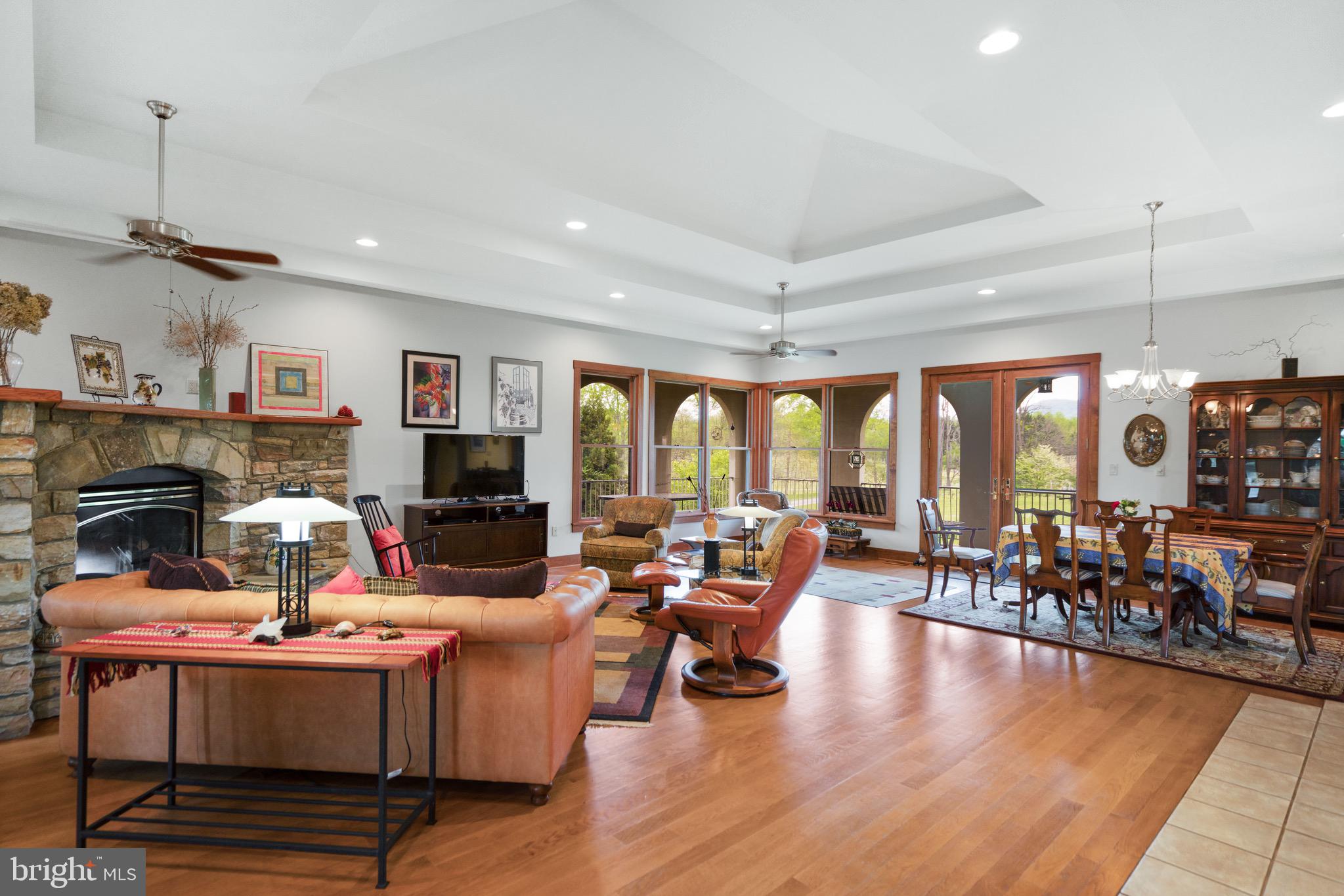 92 School House Road Washington, VA 22747 - Photo 48 of 68 a living room with fireplace furniture and a large window