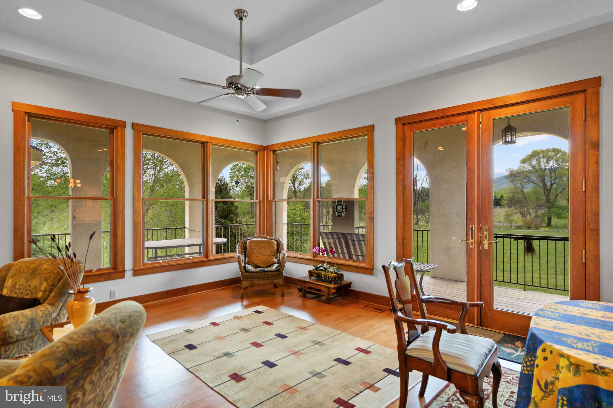 92 School House Road Washington, VA 22747 - Photo 50 of 68 a living room filled with furniture and floor to ceiling windows