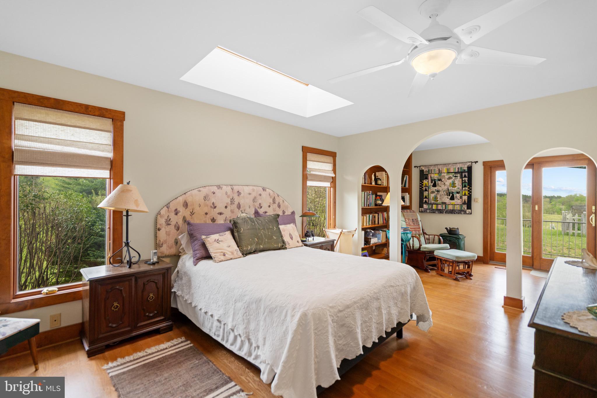 92 School House Road Washington, VA 22747 - Photo 57 of 68 a bed room with a bed and large windows