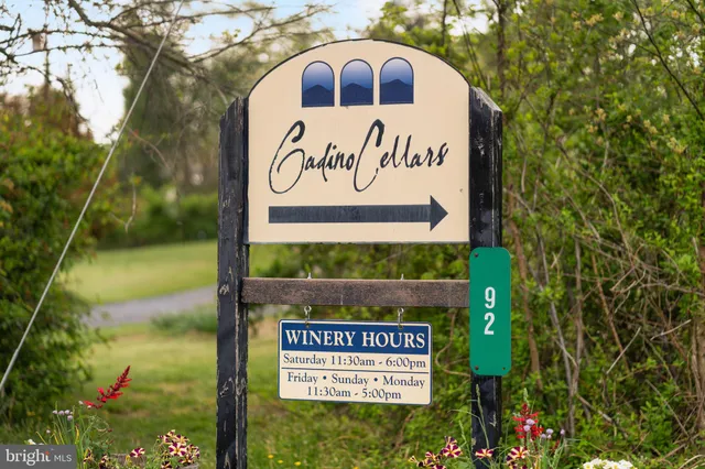 a view of a deck with chair and table with chairs