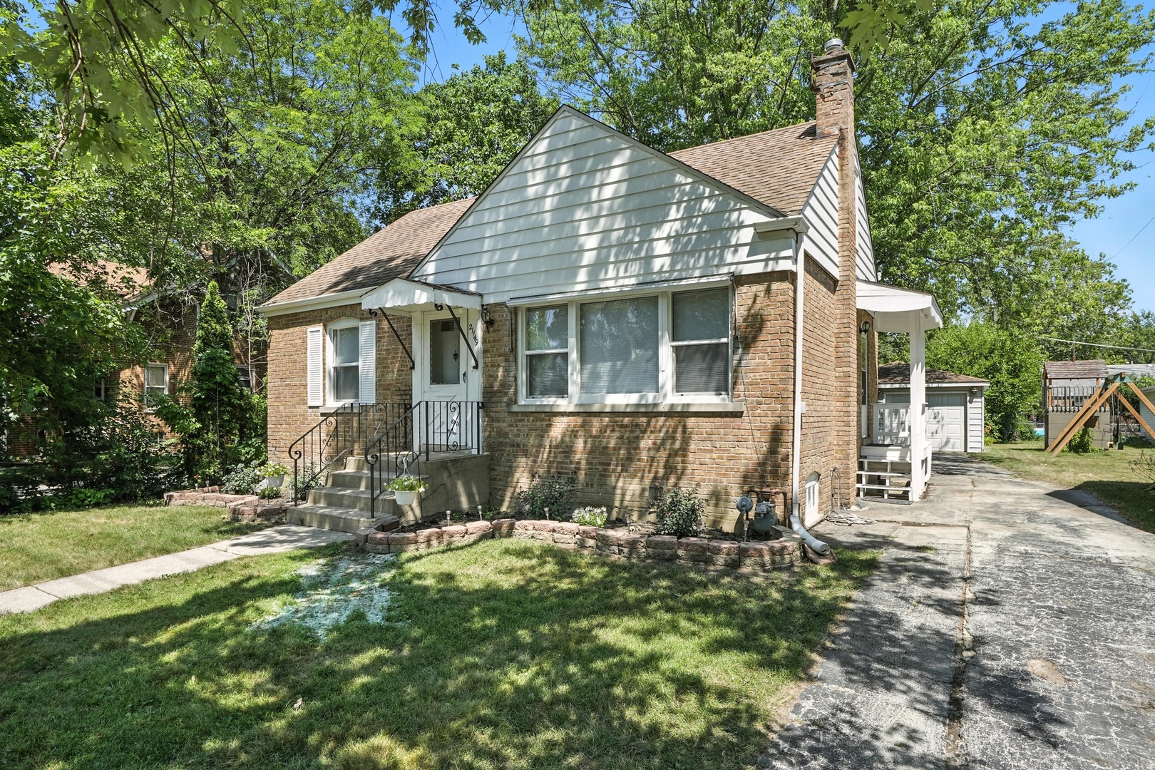 21149 Main Street Matteson, IL 60443 - Photo 2 of 20 a view of a house with backyard and sitting area