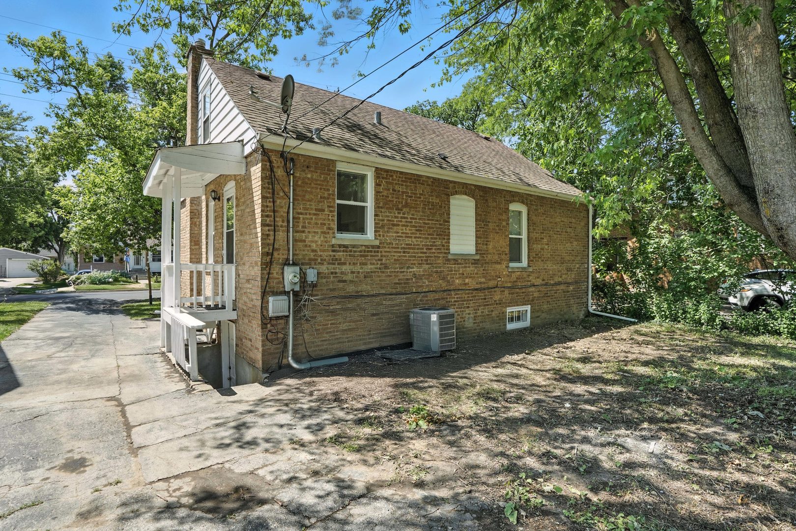 21149 Main Street Matteson, IL 60443 - Photo 3 of 20 a front view of a house with a yard