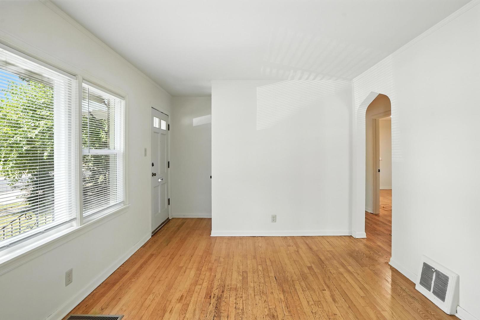 21149 Main Street Matteson, IL 60443 - Photo 6 of 20 a view of empty room with wooden floor and fan
