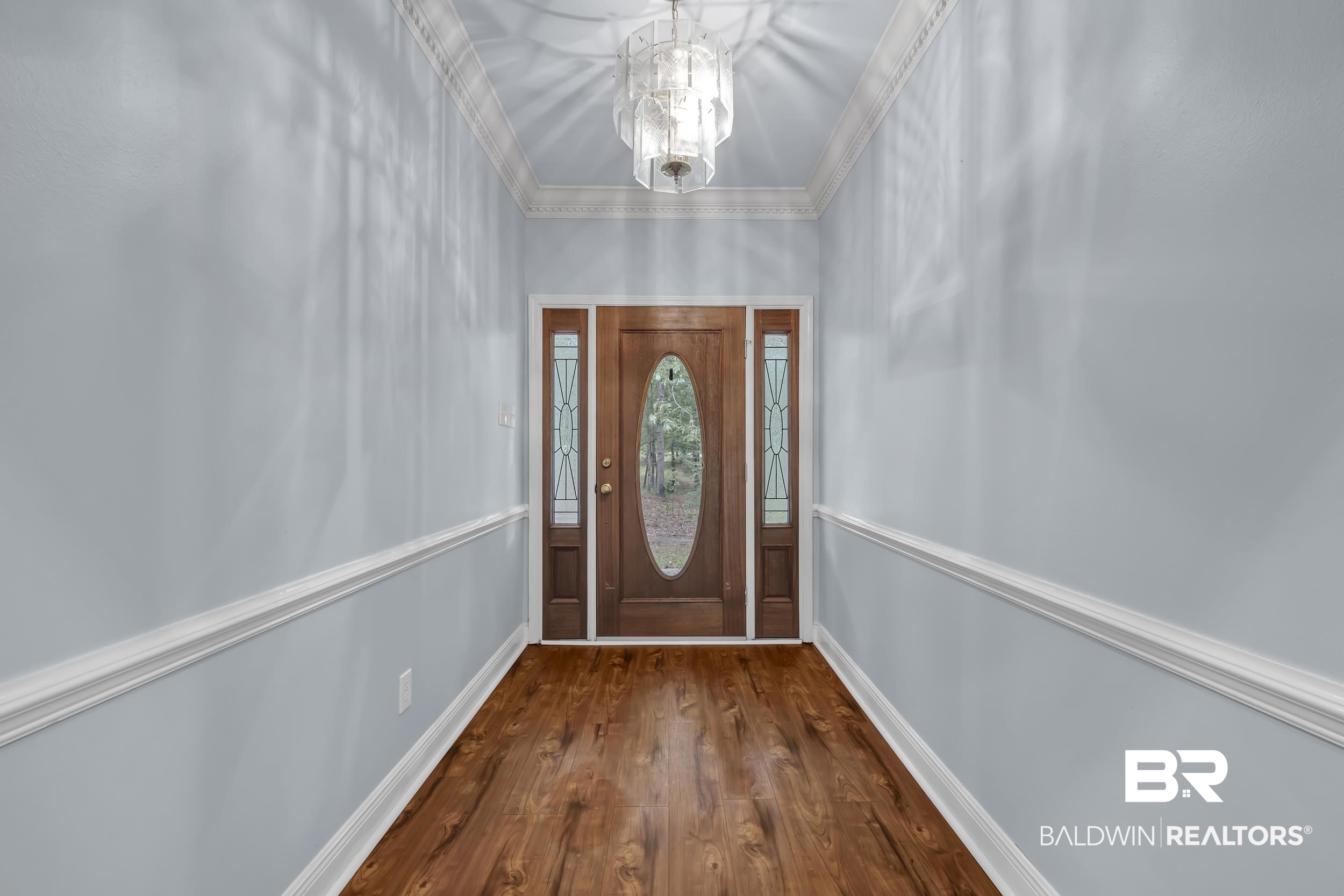 14960 Howells Ferry Road Wilmer, AL 36587 - Photo 6 of 22 Entryway featuring wood-finish flooring and a decorative chandelier