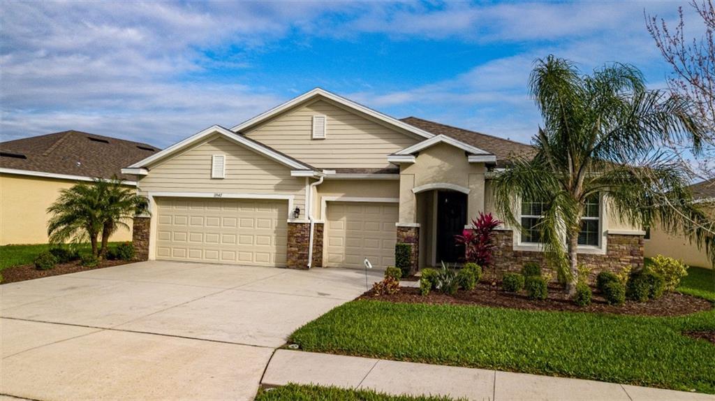 15547 Trinity Fall Way Bradenton, FL 34212 - Photo 1 of 1 a front view of house with yard and green space