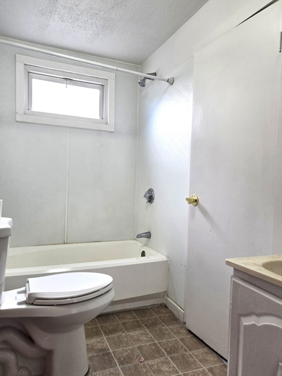 25 Myrtle Street, Unit 1F Taunton, MA 02780 - Photo 3 of 7 a bathroom with a sink toilet and shower