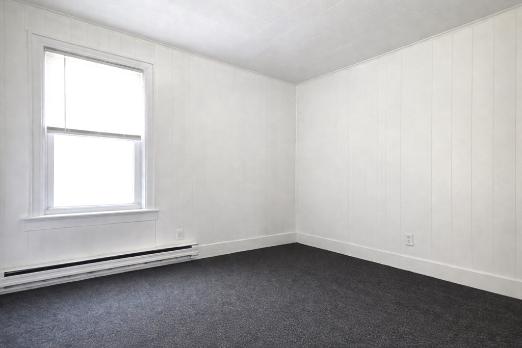 25 Myrtle Street, Unit 1F Taunton, MA 02780 - Photo 5 of 7 an empty room with a window