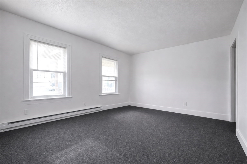 25 Myrtle Street, Unit 1F Taunton, MA 02780 - Photo 7 of 7 an empty room with a window