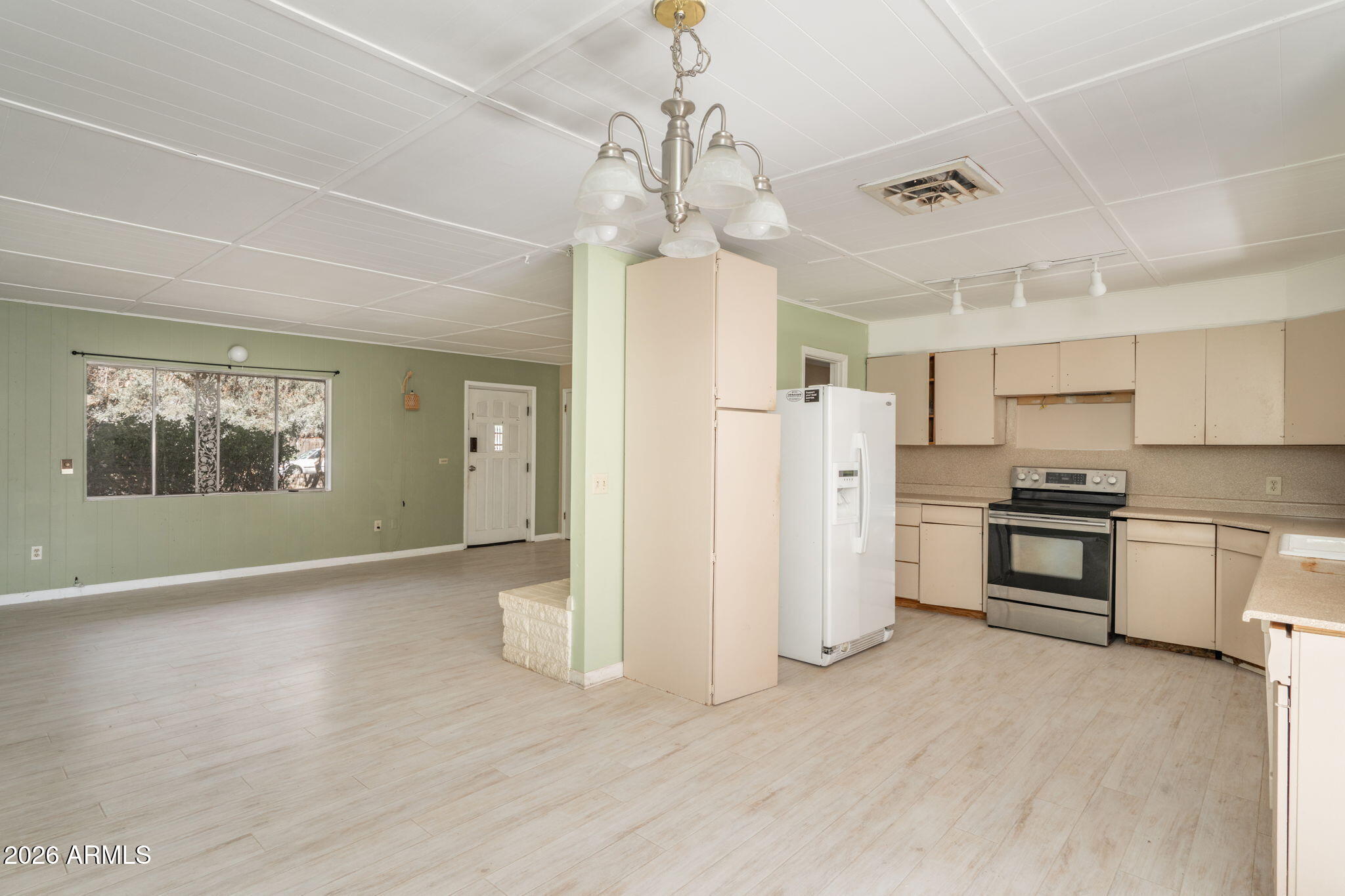 3775 East Sycamore Lane Rimrock, AZ 86335 - Photo 10 of 40 a view of a kitchen with a sink a refrigerator and window