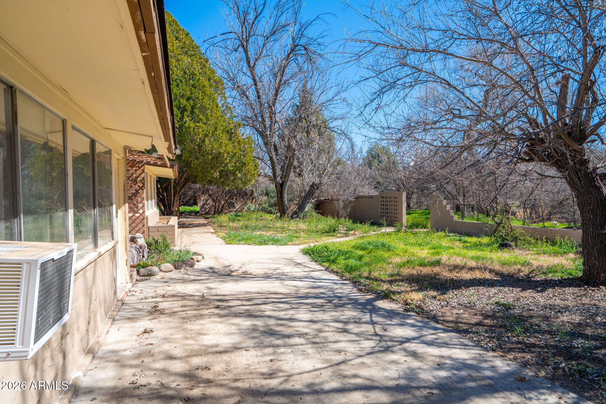3775 East Sycamore Lane Rimrock, AZ 86335 - Photo 28 of 40 a view of a yard with plants and large trees