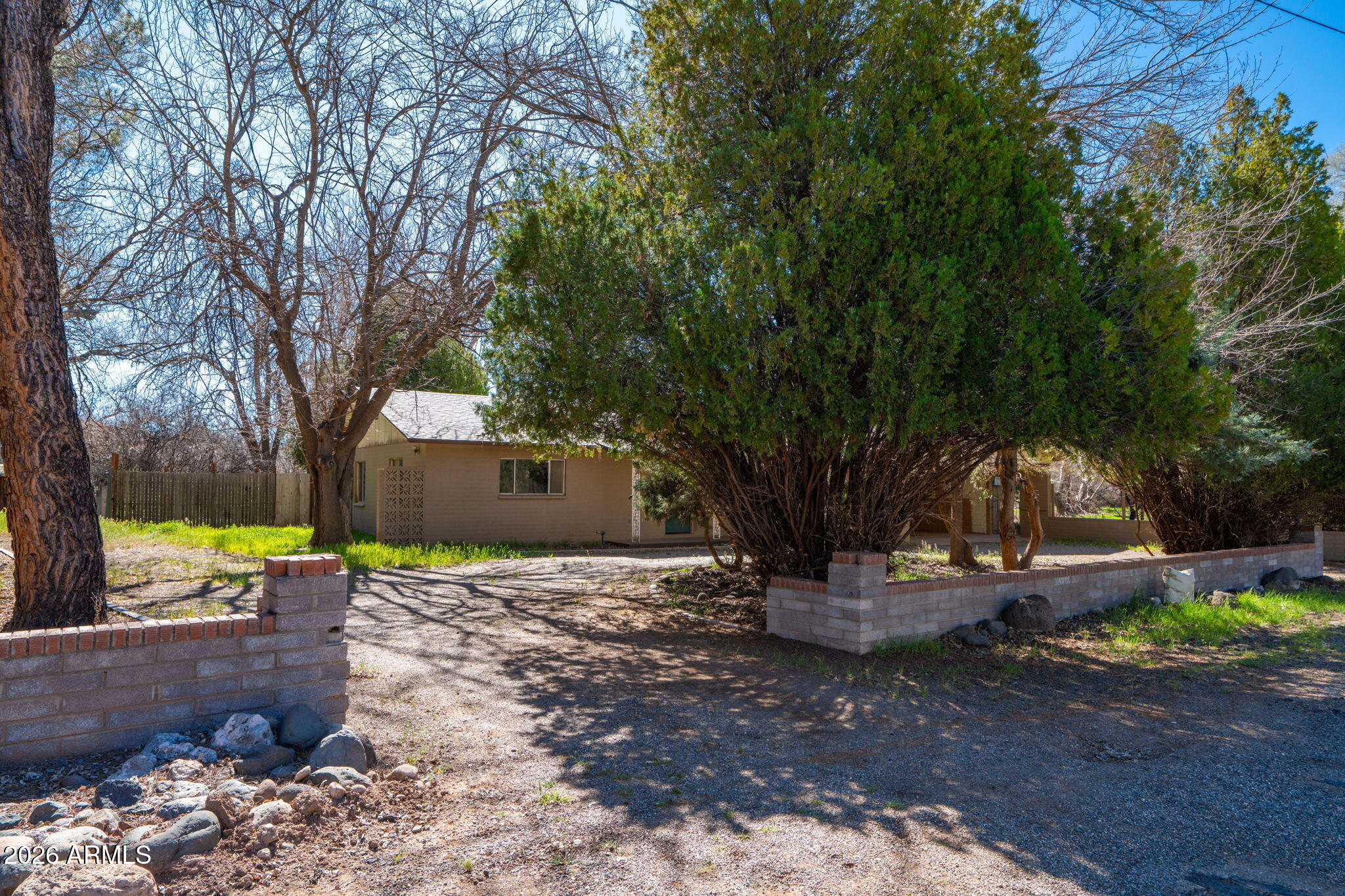 3775 East Sycamore Lane Rimrock, AZ 86335 - Photo 2 of 40 a backyard of a house with table and chairs