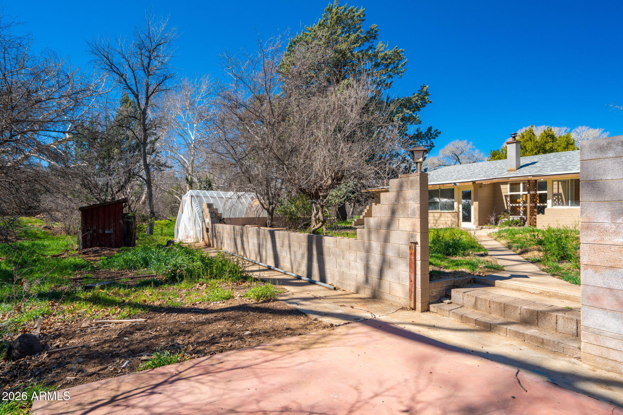 3775 East Sycamore Lane Rimrock, AZ 86335 - Photo 37 of 40 a view of a brick house with many windows next to a road