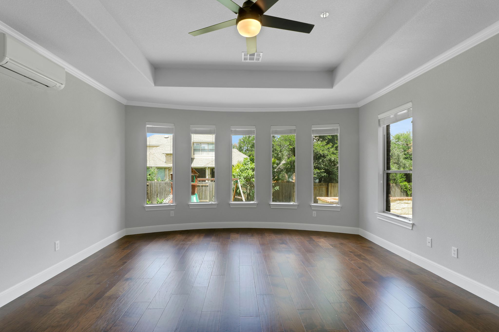3913 Remington Road Cedar Park, TX 78613 - Photo 27 of 32 Gleaming hardwood floors and a recessed tray ceiling define this versatile, window-lined space.
