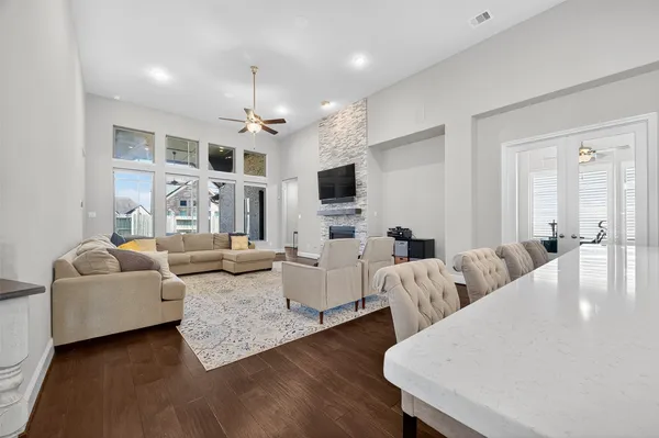 a living room with fireplace furniture and a flat screen tv