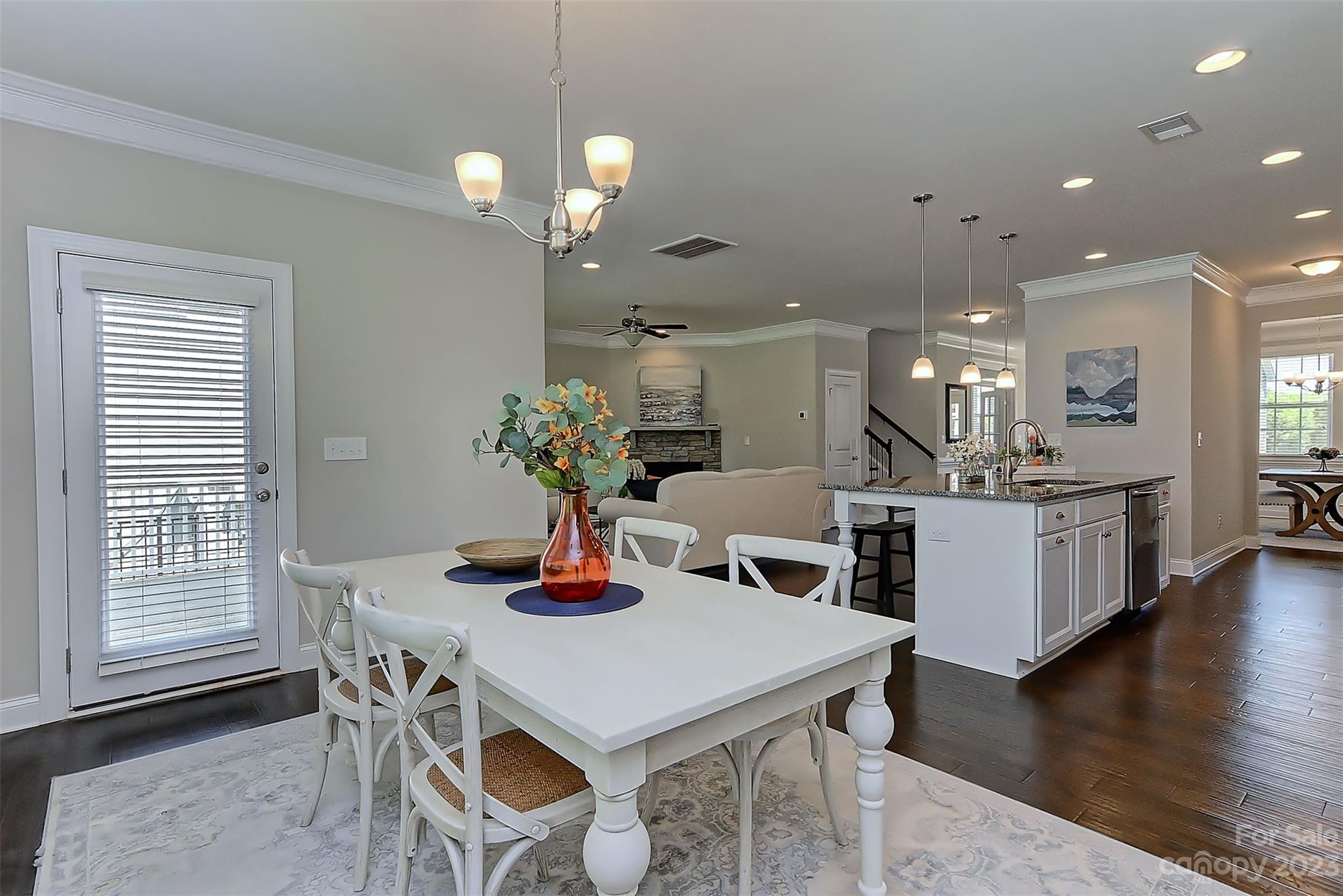 11266 Trailside Road Concord, NC 28027 - Photo 12 of 45 a view of a dining room with furniture and wooden floor