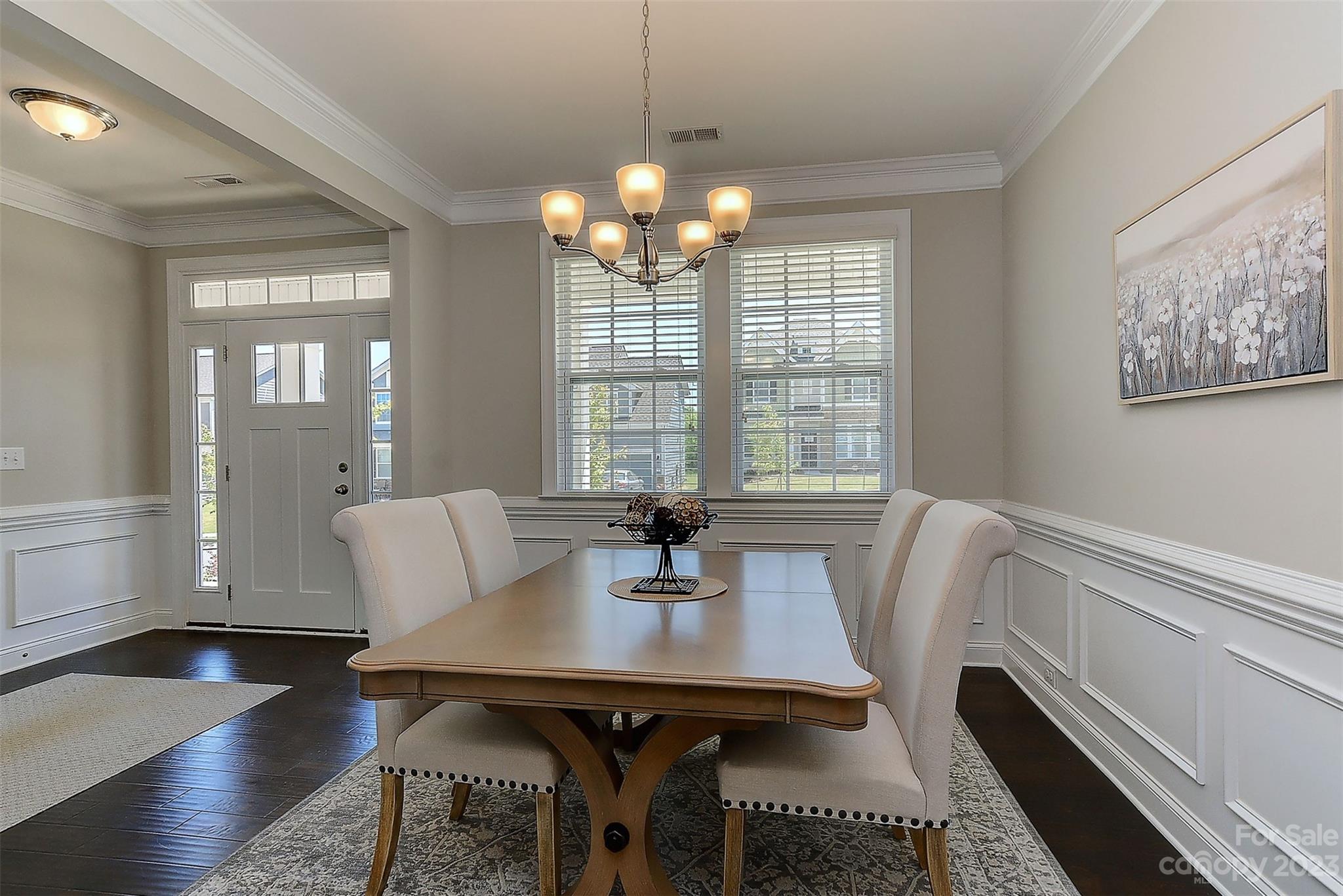 11266 Trailside Road Concord, NC 28027 - Photo 13 of 45 a view of a dining room with furniture window and wooden floor