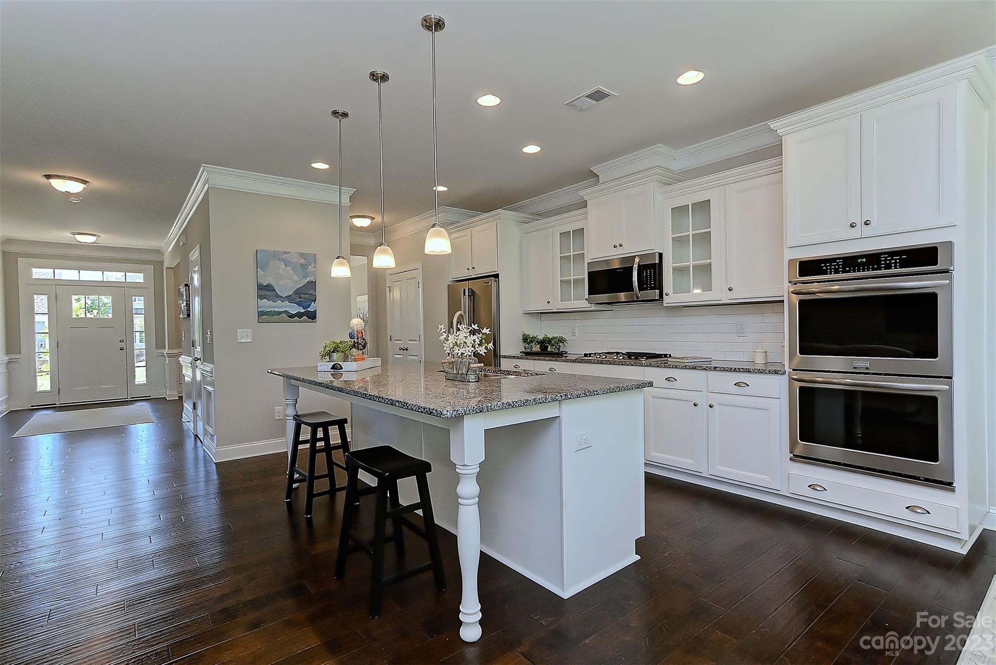 11266 Trailside Road Concord, NC 28027 - Photo 16 of 45 a kitchen with stainless steel appliances a stove sink microwave and cabinets