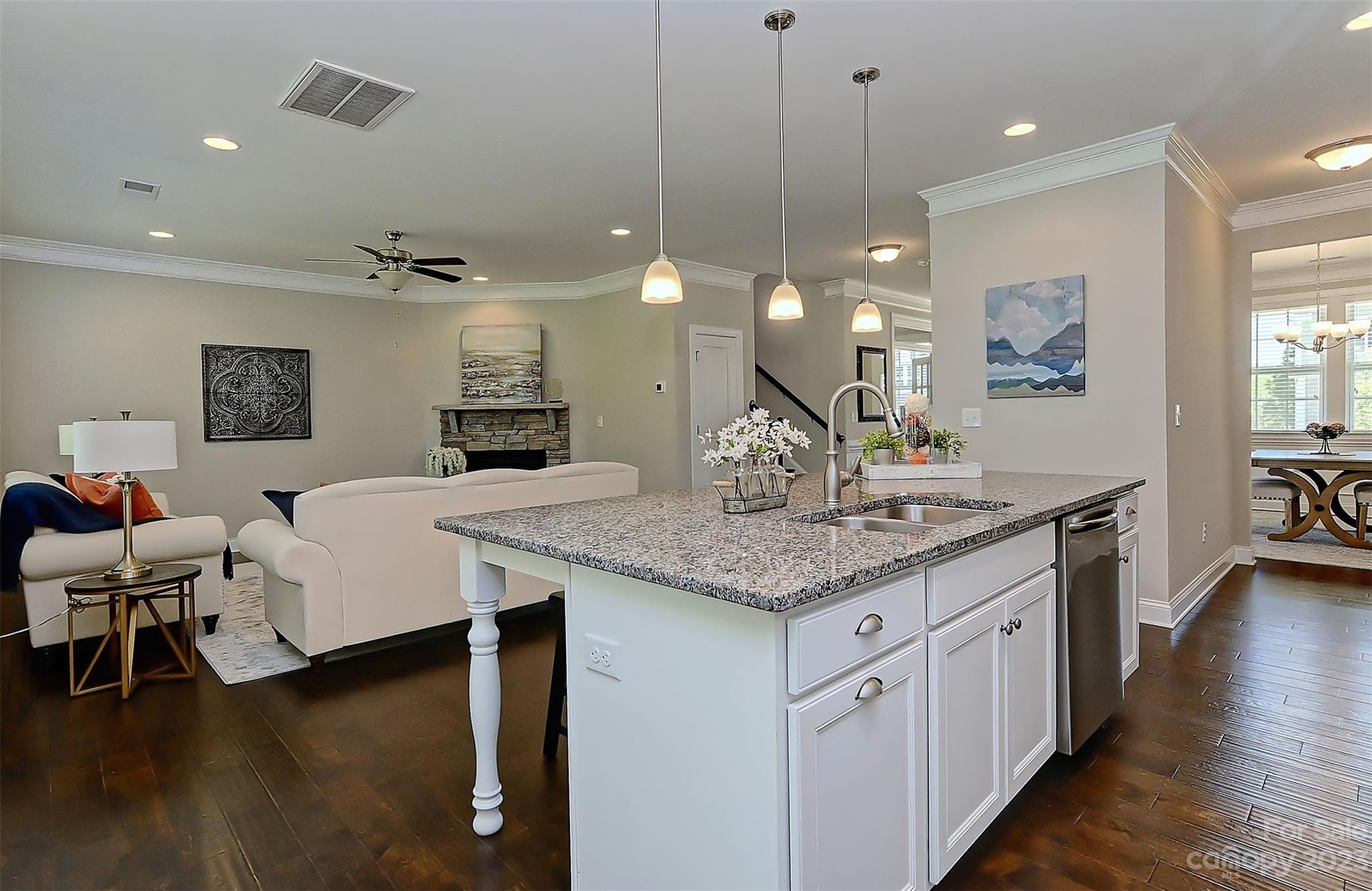 11266 Trailside Road Concord, NC 28027 - Photo 18 of 45 a spacious kitchen with a table and chairs