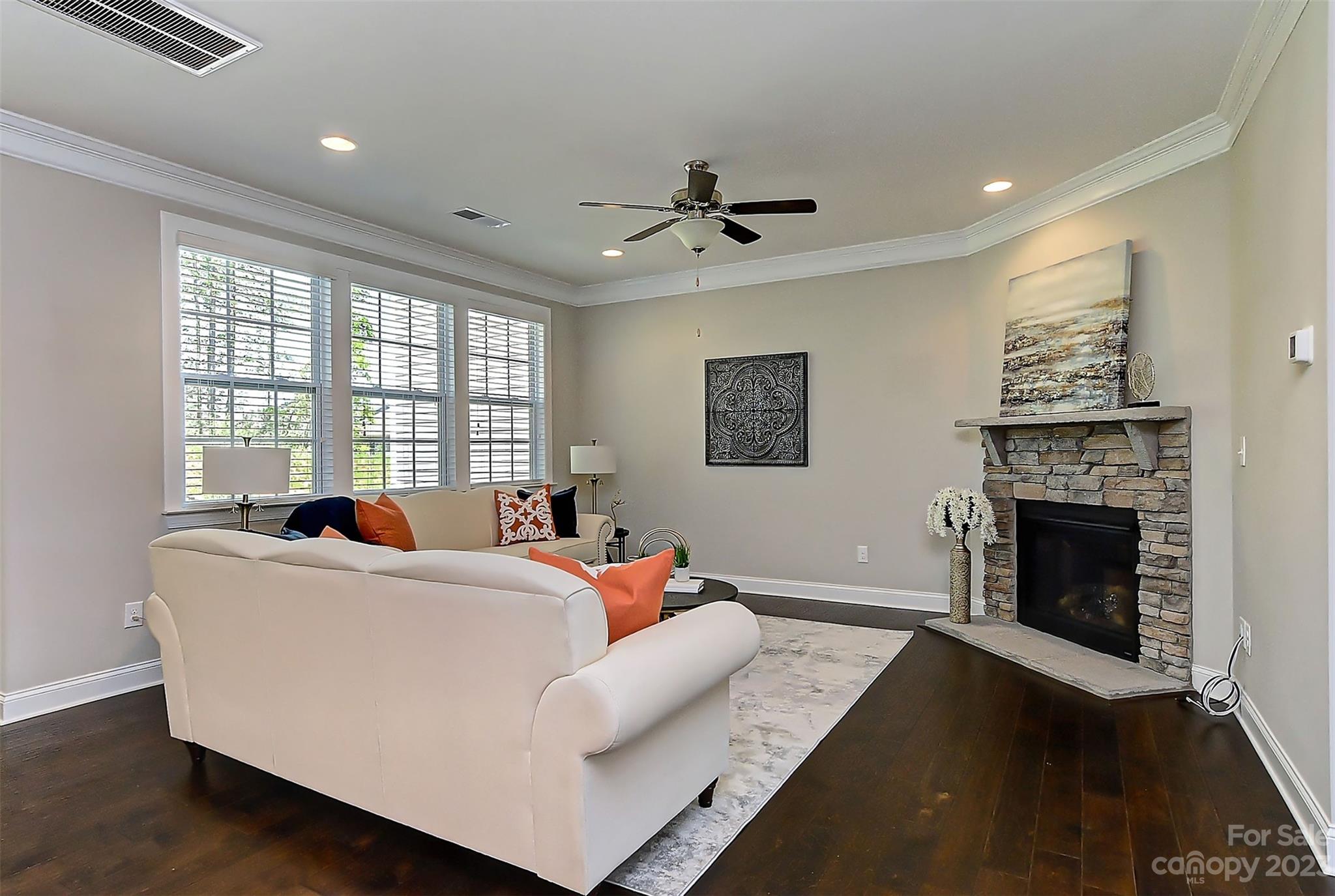 11266 Trailside Road Concord, NC 28027 - Photo 24 of 45 a living room with furniture and a fireplace