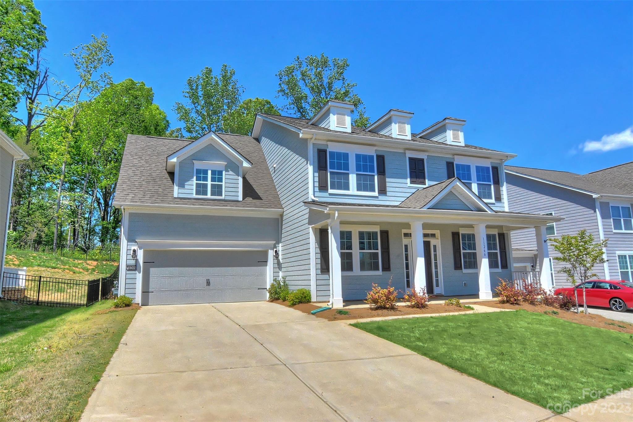 11266 Trailside Road Concord, NC 28027 - Photo 3 of 45 a front view of a house with a yard and garage